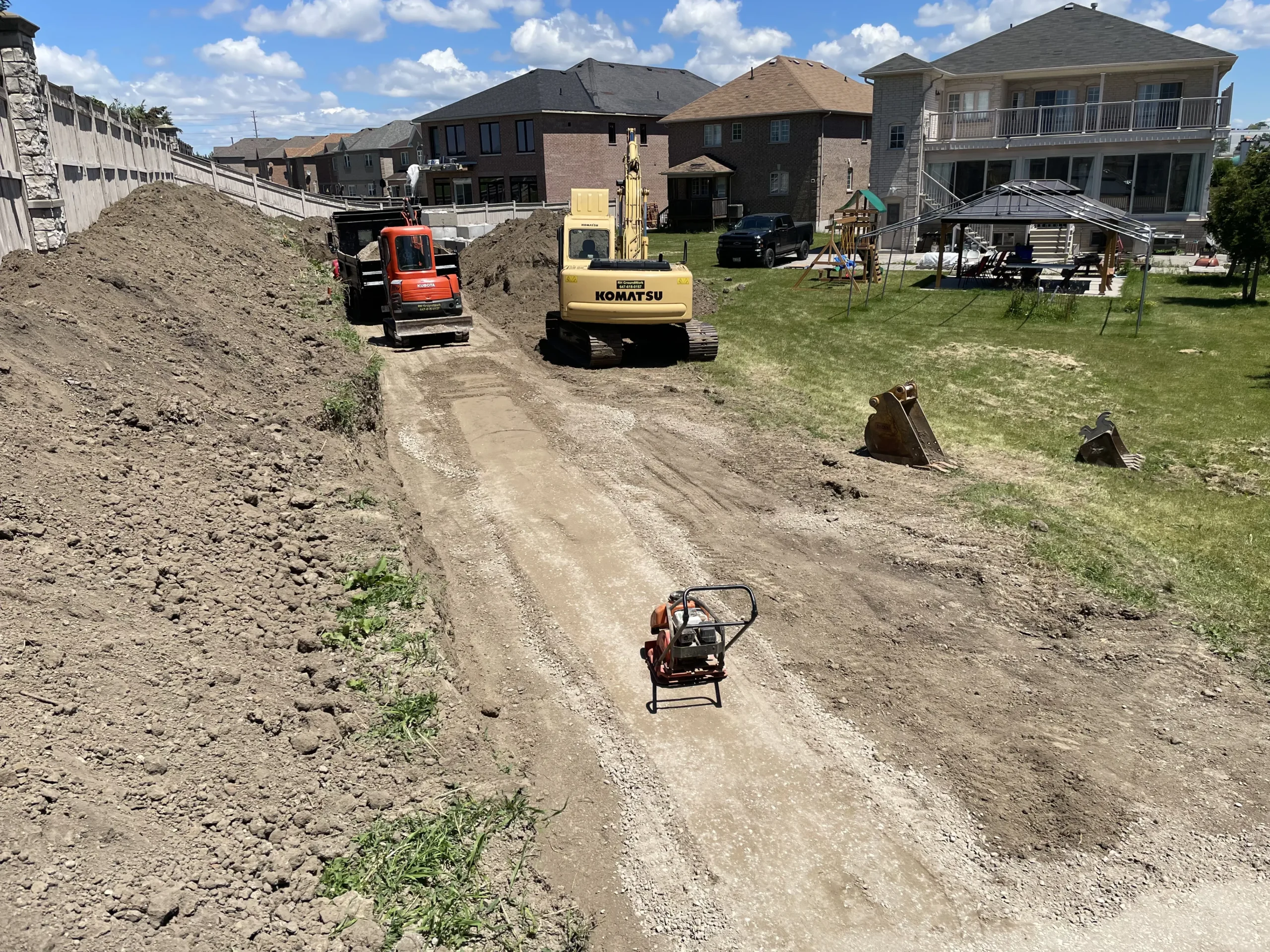 Excavation and site preparation for a retaining wall installation at a residential property in Richmond Hill, Ontario by RHGroundwork.